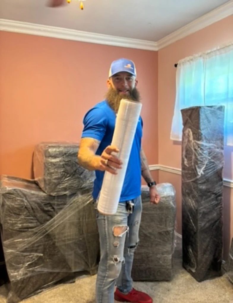Journeymen Moving mover wrapping and packing furniture for a move in Columbia, KY